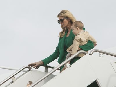 Ivanka Trump, who many have suggested will play more of a First Lady role than her step-mother, bucked with tradition and wore an emerald green outfit by Oscar De La Renta, which ensured she stood out in what was otherwise a sea of black. Her most lovely accessory - toddler son Theodore James.