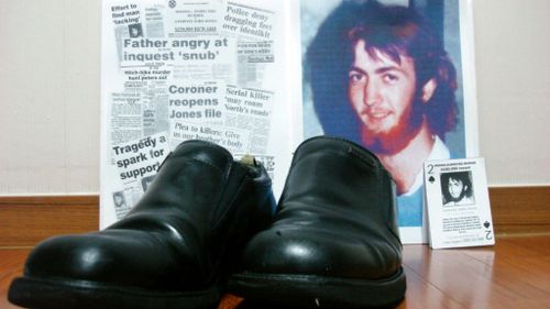 Newspaper clippings about backpacker Anthony Jones who went missing in Queensland 28 years ago, alongside an old pair of shoes. (60 Minutes)