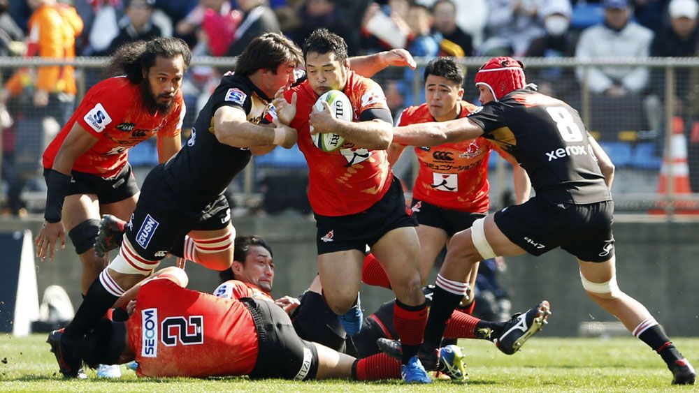 A Sunwolves player cuts through the Lions' defence. (AAP)