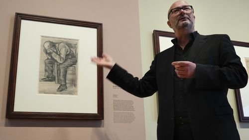 Senior researcher Teio Meedendorp gestures during the presentation of Study for "Worn Out", left, a drawing by Dutch master Vincent van Gogh, dated Nov. 1882, going on public display for the first time.