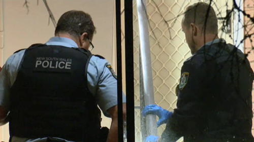 A crime scene has been established at a Marrickville unit block after a woman was stabbed multiple times.