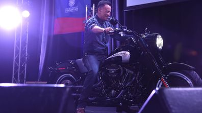 Bruce Springsteen arrives on stage on a motorcycle as The New York Comedy Festival and The Bob Woodruff Foundation present the 10th Annual Stand Up for Heroes event at The Theater at Madison Square Garden on November 1, 2016 in New York City. 