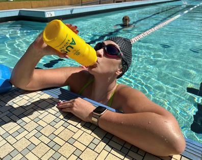 Lucy Woolfman in the pool swimming laps to raise money.