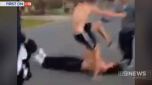 The disturbing moment the teen stomps on his victim's head. (9NEWS)