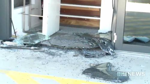 The smashed entrance to the bikie clubhouse. (9NEWS)