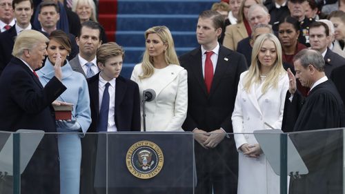 Chief Justice John Roberts administers the oath of office to President Donald Trump.