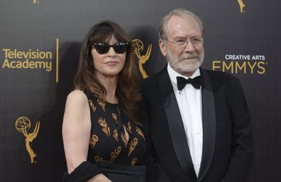 FILE -Wendy Haas, left, and Martin Mull arrive at night one of the Creative Arts Emmy Awards at the Microsoft Theater on Saturday, Sept. 10, 2016, in Los Angeles. Martin Mull, whose droll, esoteric comedy and acting made him a hip sensation in the 1970s and later a beloved guest star on sitcoms including Roseanne and Arrested Development, has died, his daughter said Friday, June 28, 2024. (Photo by Richard Shotwell/Invision/AP, File)