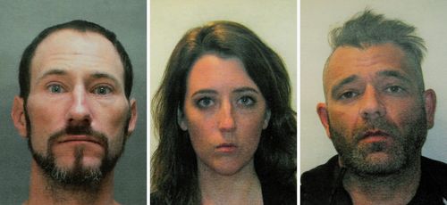 FILE - This November 2018 file combination of photos provided by the Burlington County Prosecutors office shows Johnny Bobbitt, left, Katelyn McClure and Mark D'Amico. On Tuesday, Dec. 25, 2018, GoFundMe says it has made refunds to everyone who contributed to a campaign involving homeless veteran Bobbitt who prosecutors allege schemed with a New Jersey couple, McClure and D'Amico, to scam donors out of $400,000. (Burlington County Prosecutors Office via AP, File)
