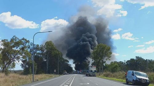 Plumes of smoke filled the air after a major multi-vehicle crash involving an army tank on a Queensland highway.