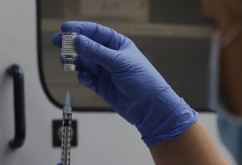 A vial of the Phase 3 Novavax coronavirus vaccine is seen ready for use in the trial