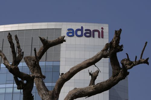 Dried tree branches stand in front of the Adani Corporate House in Ahmedabad, India, Friday, Jan. 27, 2023. Shares of India's Adani Group fell as much as 20% on Friday, as the company said it was considering legal action against the short-lived US-based company. sells Hindenburg Research amid allegations of stock market manipulation and accounting fraud that led investors to dump its stock. (AP Photo/Ajit Solanki)