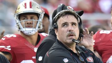Jim Tomsula, and Jarryd Hayne in the background.