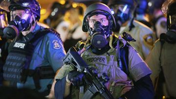State Troopers move in on the rioters. (Getty Images)