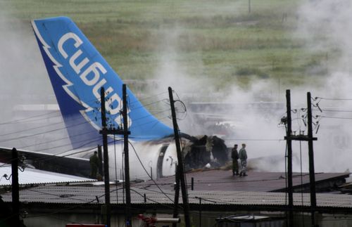 The wreckage of an Airbus A-310 plane sits smoldering after crashing in the Siberian city of Irkutsk, Russia, in this July 9, 2006,file photo, with the logo of the Sibir airline on the wreckage. The Russian passenger plane burst into flames after it crashed on landing in the Siberian city of Irkutsk. (AP Photo/FILE)