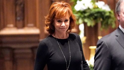 Country music star Reba McEntire was due to be among the musical performers at today's service.