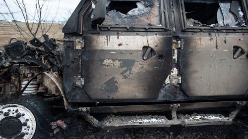 MYKOLAIV, UKRAINE - MARCH 10:  A burnt out Russian Tigr fighting vehicle sits long a road, the Z letter on the door denoting its Russian origin as Ukraine Army troops dig in at frontline trench positions to continue repelling Russian attacks, east of the strategic port city of Mykolaiv, Ukraine, on March 10, 2022. Ukrainian forces have fended off several concerted ground attacks, with Russian forces coming northwest from Crimea and via Kherson, and filing frequent missile and rockets strikes on 