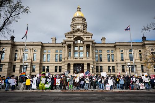 Protesters gather outside the Wyoming State Capitol during the No Kings protest Saturday, Oct. 18, 2025, in Cheyenne, Wyo. (Milo Gladstein/The Wyoming Tribune Eagle via AP)