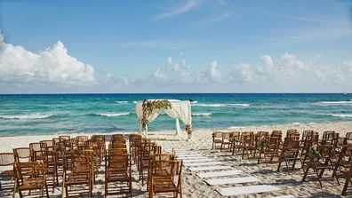 Chairs and flowers for a wedding in Cancun mexico by the beautiful ocean