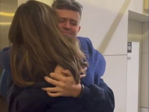 Bodi ﻿Risby-Jones is reunited with his mother after arriving back in Australia.