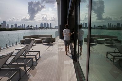 Nicolas Derouin, co-founder of the Arkup houseboat, a green-energy luxury floating home that can allow owners to adapt as the sea level continues to rise, gives a tour of the first floor patio area on May 14, 2019 in Miami Beach, Florida. 