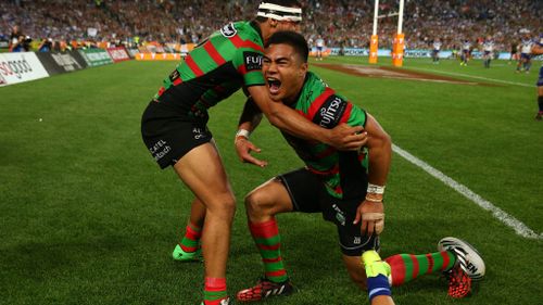 Kirisome Auva'a of the Rabbitohs celebrates with team mates after scoring a try. (Getty)