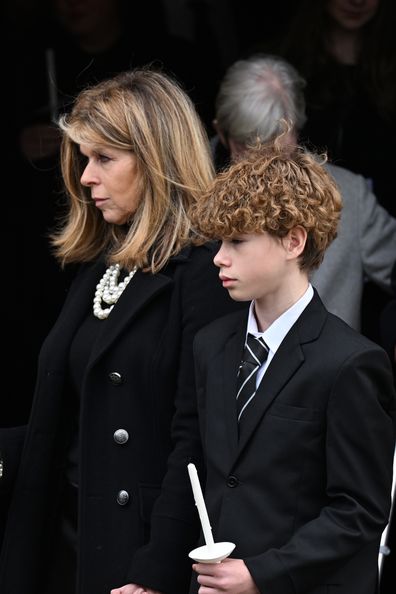 Kate Garraway and son Billy Draper depart the funeral of Derek Draper at St Mary the Virgin Church, on February 02, 2024 in London 