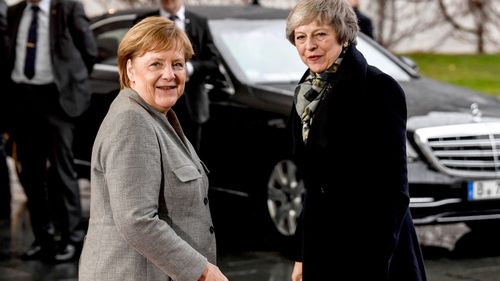 German Chancellor Angela Merkel welcomes British Prime Minister Theresa May at the Chancellery in Berlin, Germany.