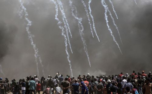 Tear gas rains down on protesters in Gaza. Picture: EPA