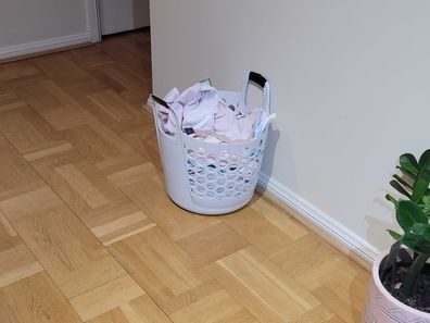 washing basket full of tea towels