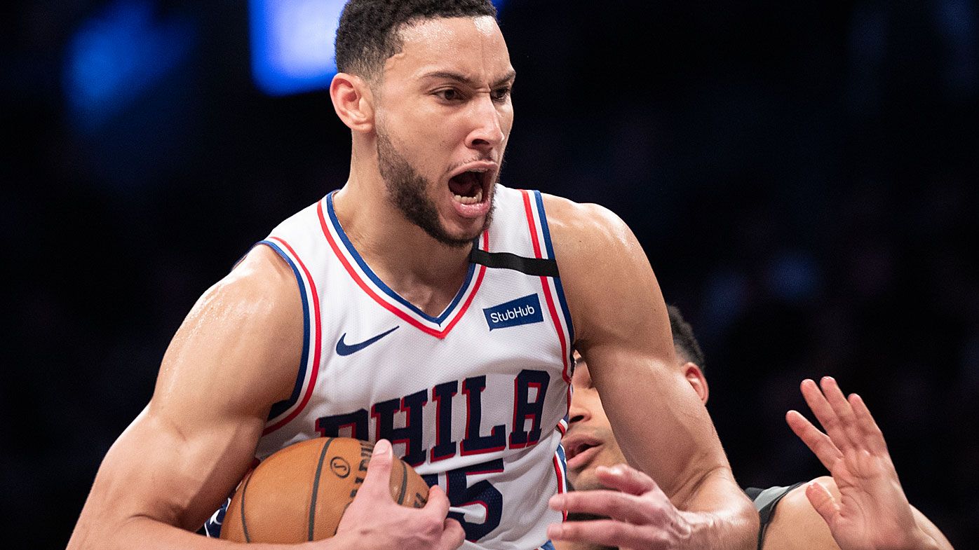 Philadelphia 76ers guard Ben Simmons reacts after grabbing a rebound during the second half of an NBA game against the Brooklyn Nets