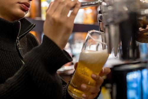 LONDON, ENGLAND - SEPTEMBER 26: A member of the bar staff pours a pint of beer at the Westminster Arms pub on September 26, 2024 in London, England. Researchers from the University of Cambridge say that if licensed premises across the UK reduced the standard serving of beer from a pint to two-thirds of a pint, it could reduce alcohol consumption overall and improve public health. (Photo by Jack Taylor/Getty Images)