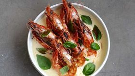Burleigh Pavillion's The Tropic's grilled tiger prawns, dry vermouth butter, shellfish oil, basil