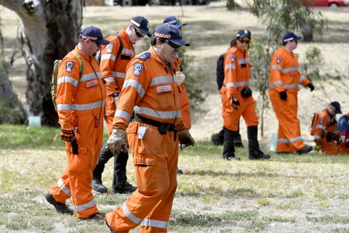 SES workers are assisting police with their search around the dense scrub near the Christie Creek catchment in Morphett Vale.