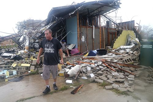 Brian Bon inspects the damage after Hurricane Michael smashed into homes in Panama City, Florida.