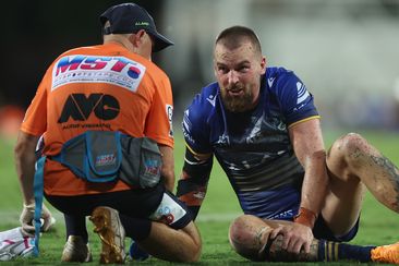 Clint Gutherson attended to by a trainer after an injury during the round seven NRL match between Parramatta Eels and Dolphins. 