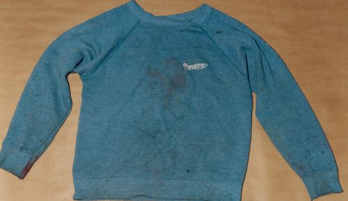 Photo issued by Sussex Police of a blue Pinto sweatshirt, allegedly worn by Russell Bishop and said to contain vital DNA evidence, which was found beside a path behind Moulsecoomb railway station.