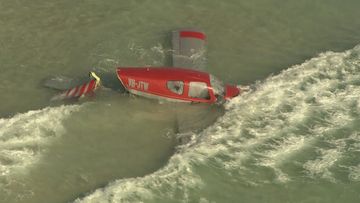 A light aircraft ditched into the ocean off Perth&#x27;s City Beach with a pilot and passenger on board escaping
