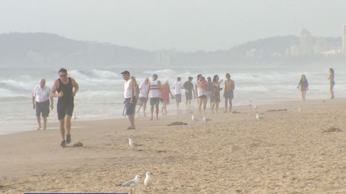 In Brisbane, locals hit the beach to cool off as parts of the city reached 40 degrees. (9NEWS)