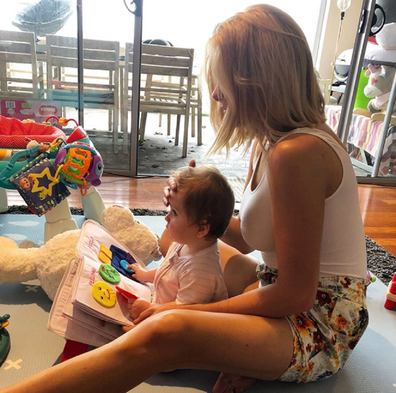 Erin reading a book with Eliza