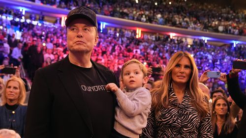 Elon Musk and former first lady Melania Trump listen as Republican presidential nominee former President Donald Trump speaks at a campaign rally at Madison Square Garden, Sunday, Oct. 27, 2024, in New York. 