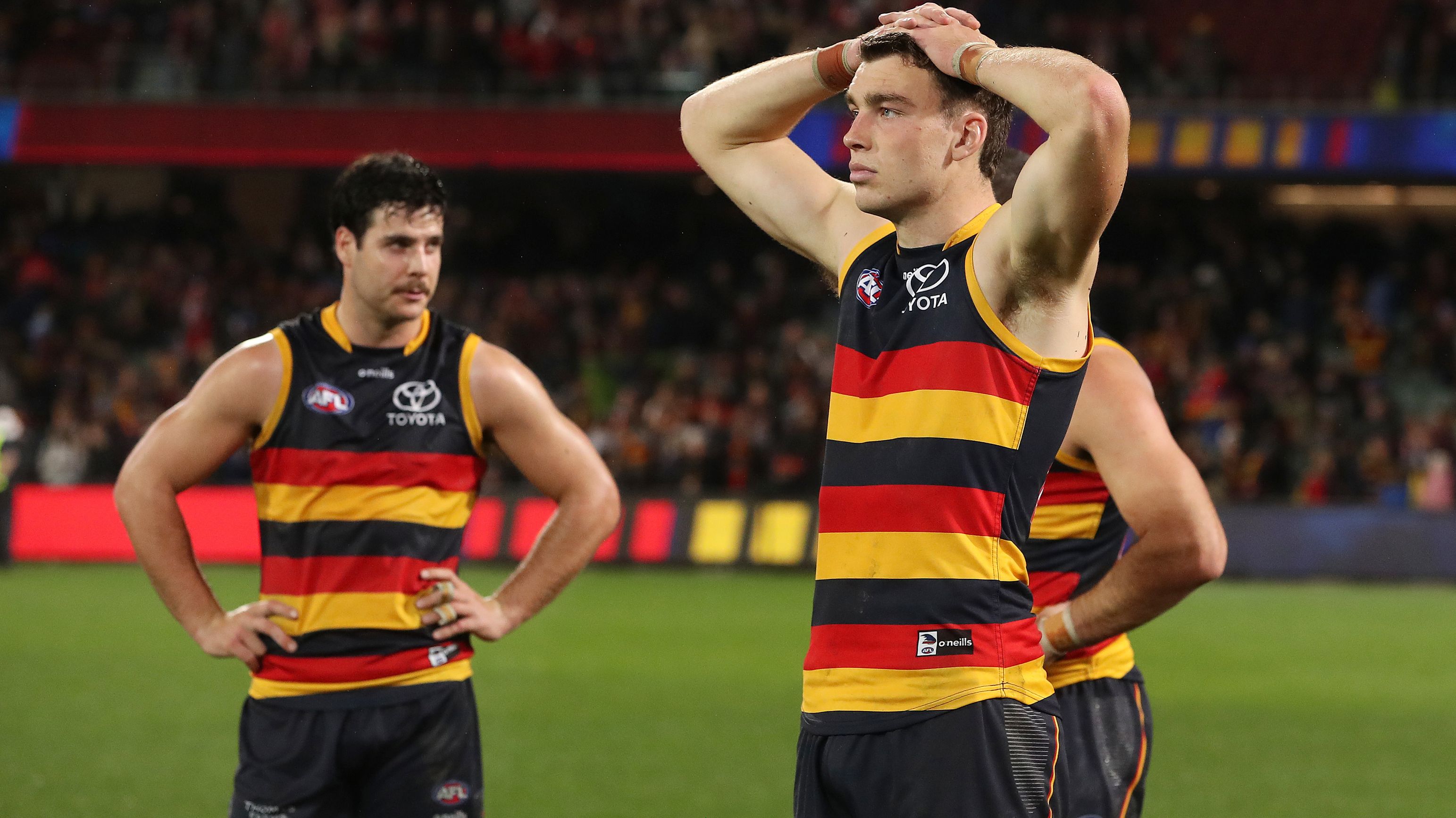Riley Thilthorpe and Darcy Fogarty of the Crows after their loss to the Swans.