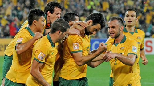 Socceroos captain Mile Jedinak (centre) celebrates after scoring a goal in the win over Kuwait. (AAP)