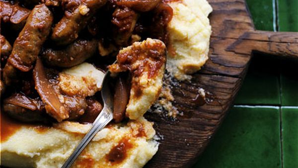 Tomato-braised sausages on parmesan polenta