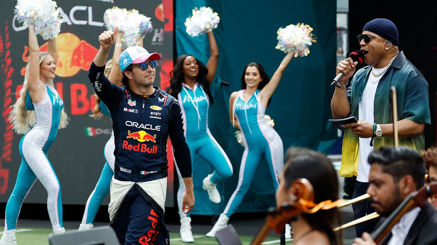 Sergio Perez of Mexico and Oracle Red Bull Racing walks out onto the grid prior to the F1 Grand Prix of Miami at Miami International Autodrome on May 07, 2023 in Miami, Florida. (Photo by Chris Graythen/Getty Images)