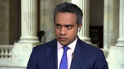 CNN political reporter Manu Raju with a cicada on his lapel.