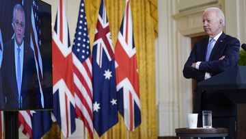 President Joe Biden, listens as he is joined virtually by Australian Prime Minister Scott Morrison and British Prime Minister Boris Johnson, not seen, as he speaks about a national security initiative from the East Room of the White House in Washington.