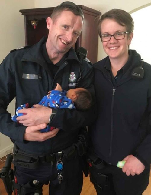 The officers with little Ryder. (Victoria Police)