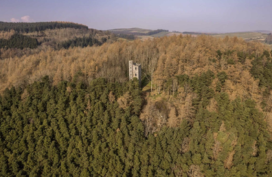 The gothic tower is nestled in a hilltop location and has sweeping views.
