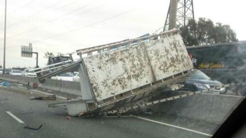 Trapped truck driver freed in Melbourne after crash shuts down large sections of Monash Freeway