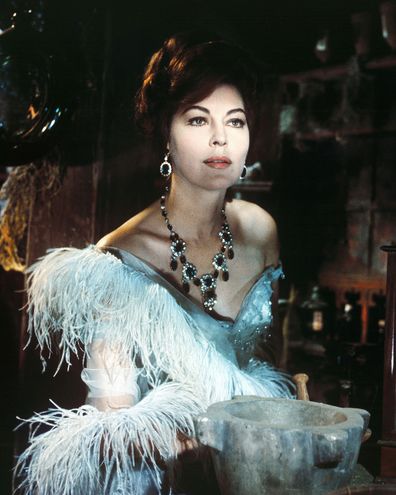 Gardner in period costume with an ornate necklace in a publicity portrait issued for the film, '55 Days at Peking', 1963. 